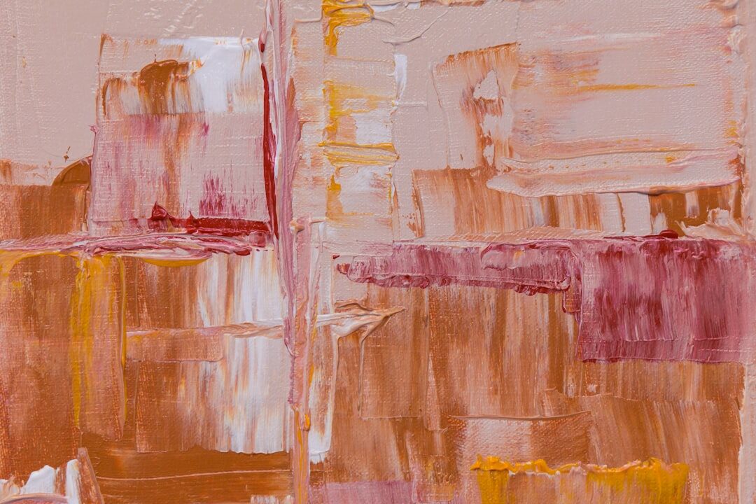Vivid abstract painting with pink and orange shapes