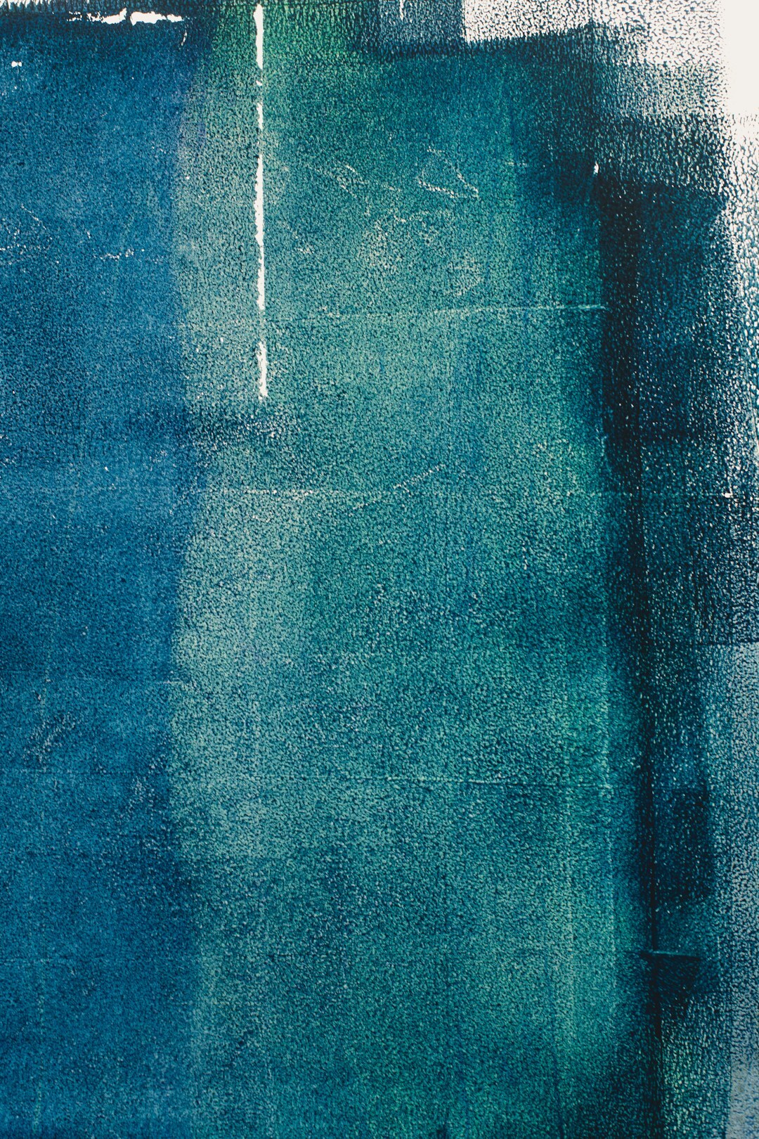 Abstract painting with blue and teal paint texture