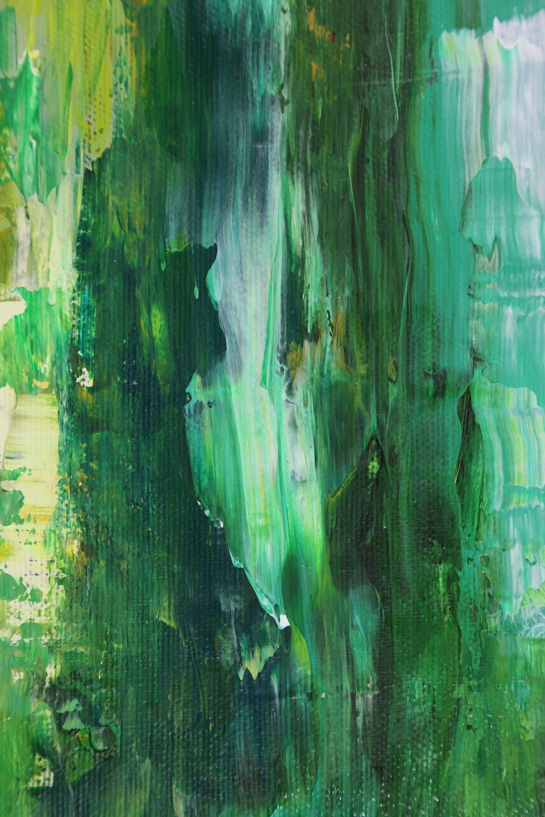 Abstract painting with green and yellow brush strokes